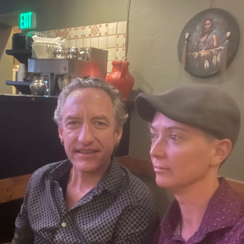 Gary and Amy in a restaurant booth