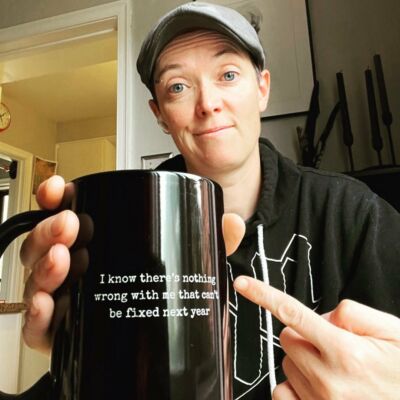 Amy holding the High Fiction lyric mug